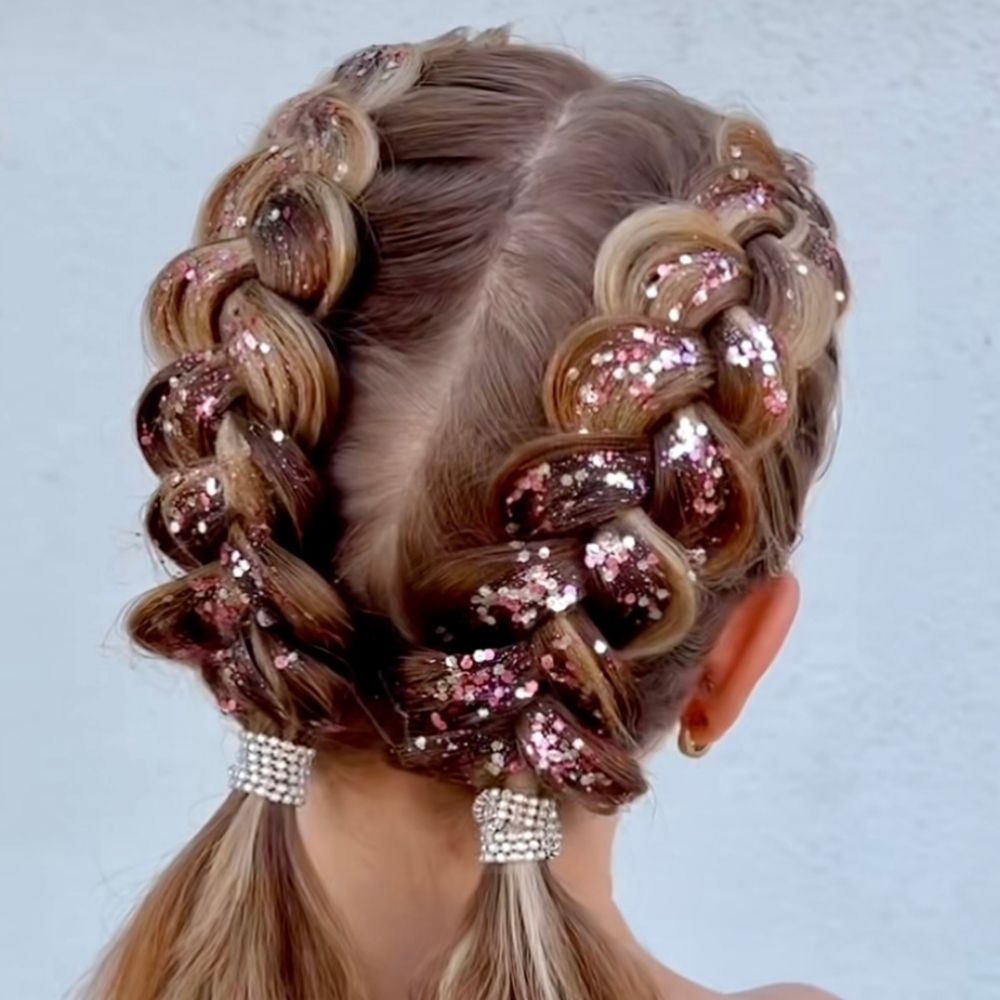 Model wearing Unicorn Fantasy biodegradable glitter in braids