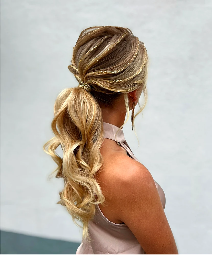 Blonde ponytail styled with gold glitter stripes