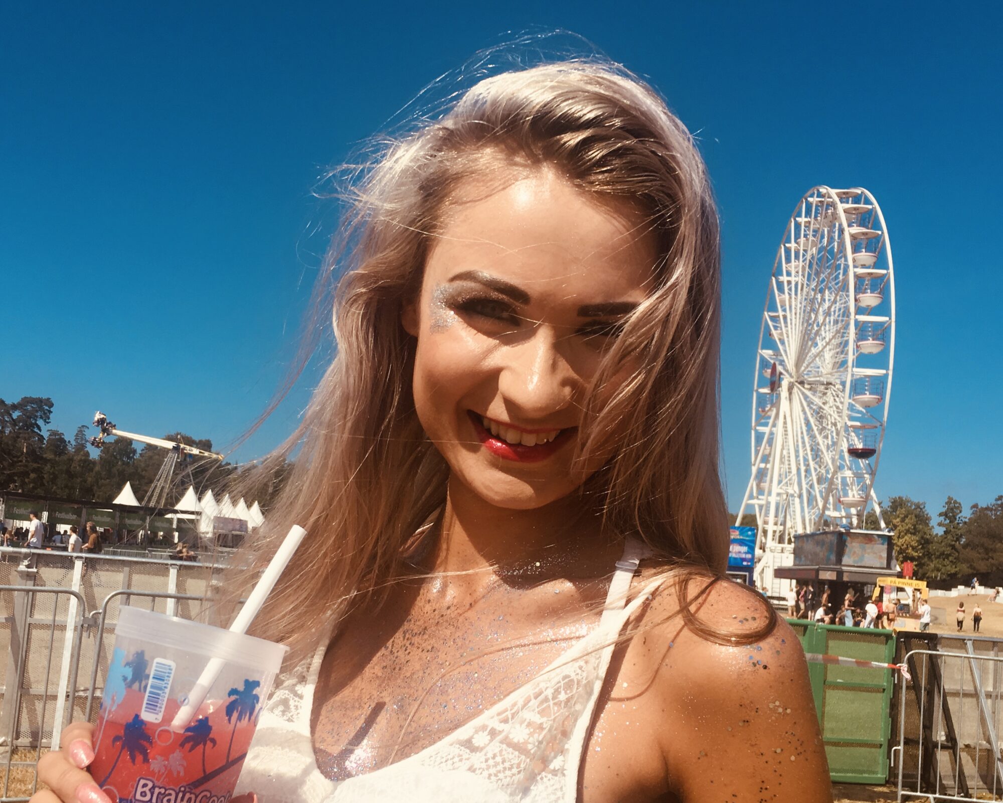 Model wearing Glitter Eco Lovers biodegradable glitter makeup created with plant-based ingredients.