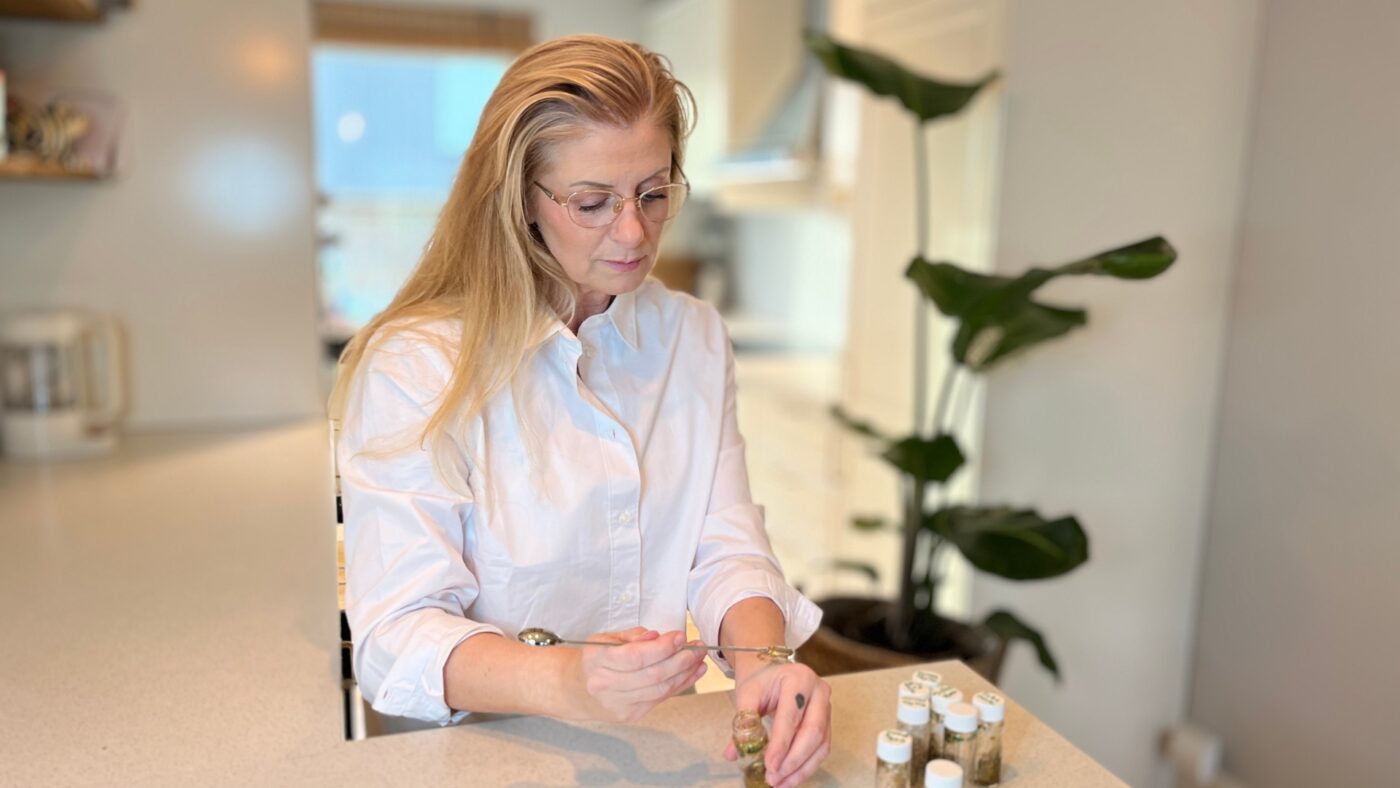Charlotte Bakke reviewing test samples from the Clean Glam Beauty research project, exploring plant-based and plastic-free shimmer formulations.